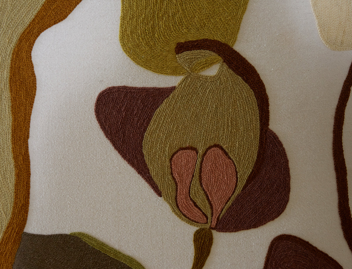 Close-up of a fabric with brown and green abstract pattern